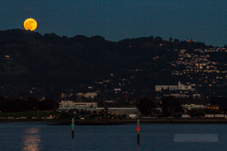 View of full moon rising above the Claremont Hotel